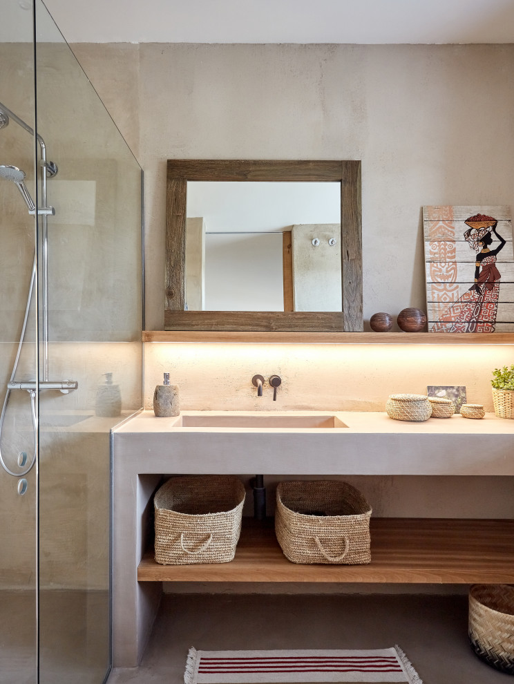 Inspiration for a mid-sized mediterranean bathroom in Other with open cabinets, white cabinets, beige tile, cement tile, concrete floors, grey floor and white benchtops.