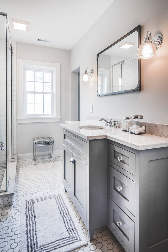 Design ideas for a small transitional master bathroom in Columbus with shaker cabinets, grey cabinets, a two-piece toilet, white tile, ceramic tile, grey walls, ceramic floors, engineered quartz benchtops and an undermount sink.