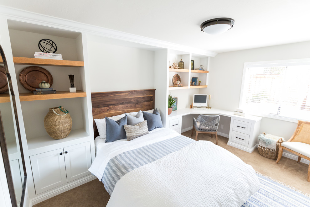 This is an example of a mid-sized country guest bedroom in San Diego with white walls, carpet and beige floor.