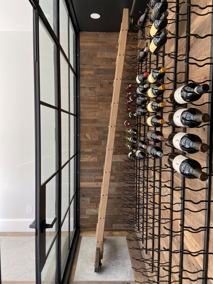 Inspiration for a mid-sized farmhouse concrete floor and multicolored floor wine cellar remodel in San Francisco