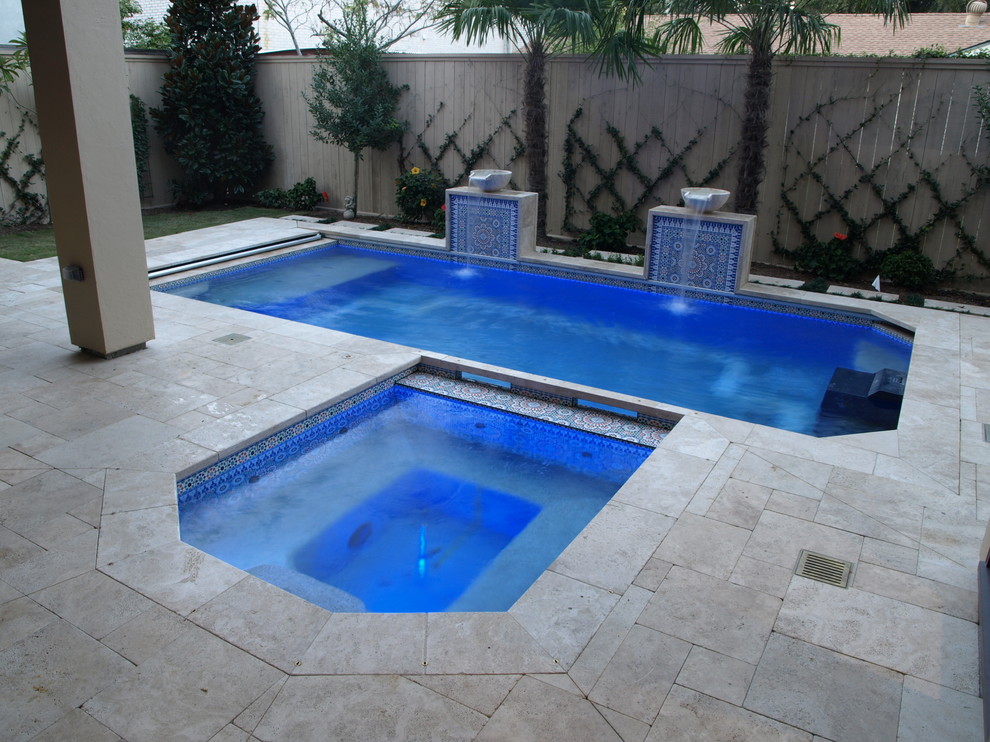 Photo of a mid-sized asian backyard rectangular lap pool in Houston with a water feature and tile.