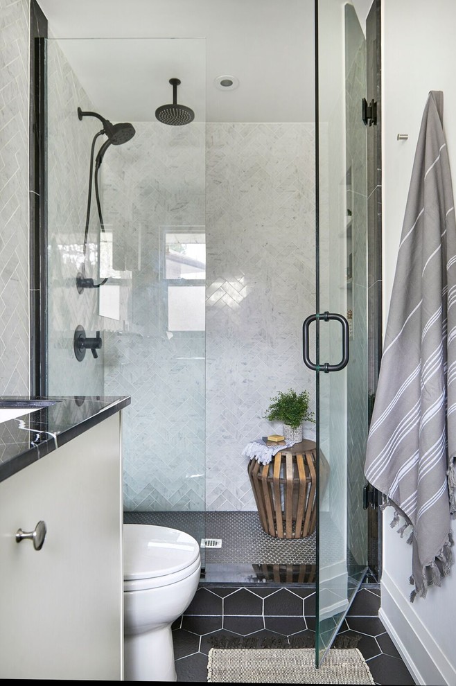 Small contemporary 3/4 bathroom in Toronto with flat-panel cabinets, white cabinets, an alcove shower, a one-piece toilet, gray tile, marble, white walls, slate floors, a trough sink and marble benchtops.