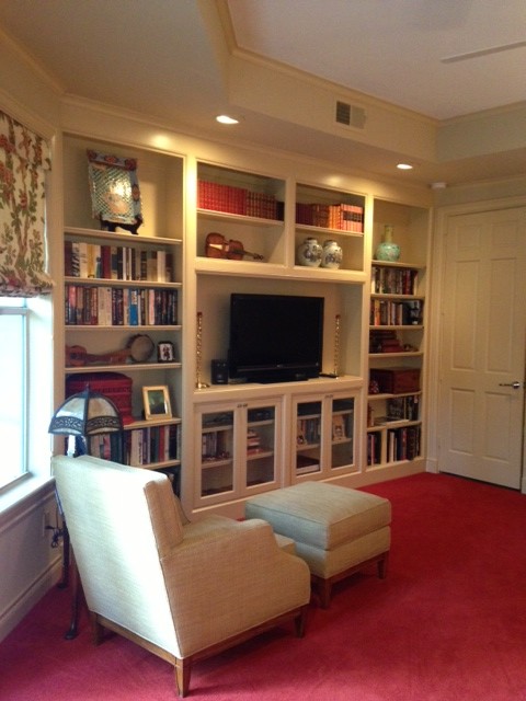 Photo of a large traditional master bedroom in Houston with beige walls and carpet.