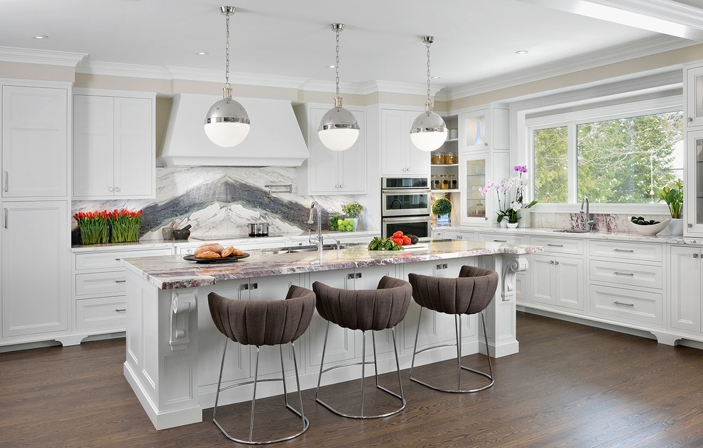 Design ideas for a large transitional u-shaped open plan kitchen in Toronto with an undermount sink, shaker cabinets, white cabinets, marble benchtops, white splashback, stone slab splashback, panelled appliances, dark hardwood floors and with island.