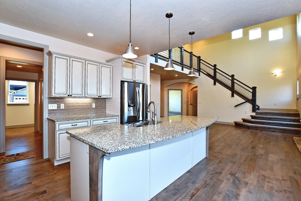 Example of a transitional kitchen design in Denver