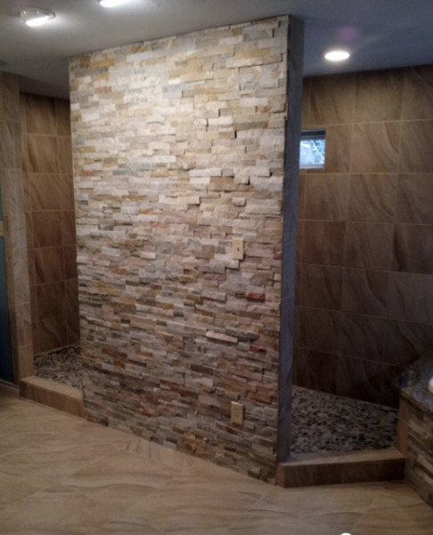 Example of a large transitional master beige tile beige floor drop-in bathtub design in Austin with shaker cabinets, dark wood cabinets and beige walls