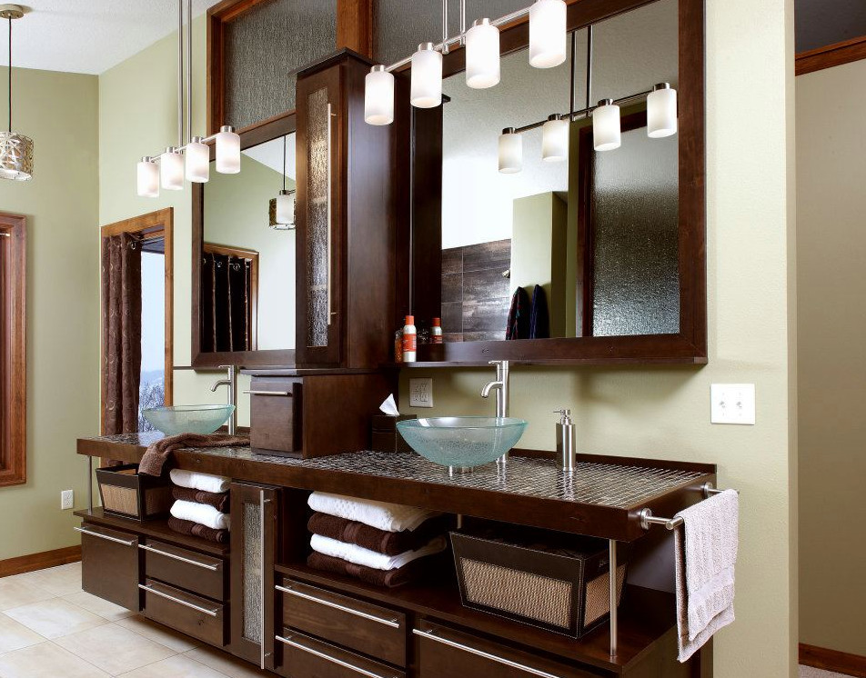 Bathroom - large transitional master ceramic tile and beige floor bathroom idea with flat-panel cabinets, brown cabinets, beige walls, a vessel sink and tile countertops