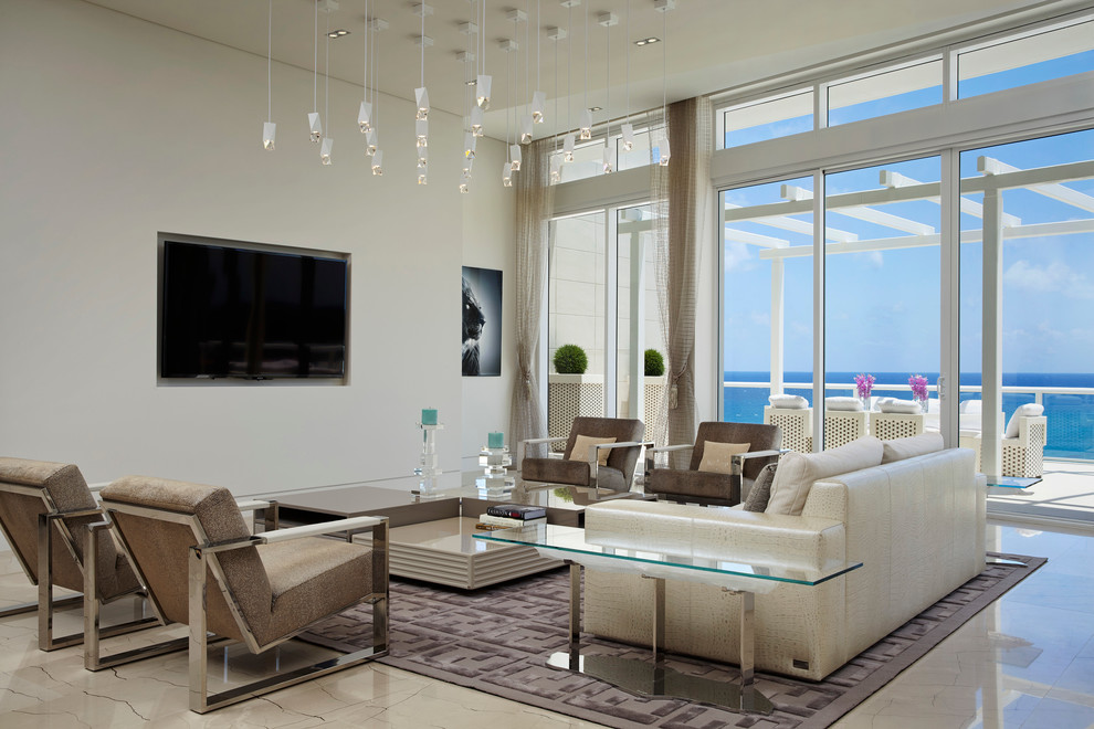 Design ideas for a large contemporary formal open concept living room in Miami with white walls, marble floors and a wall-mounted tv.