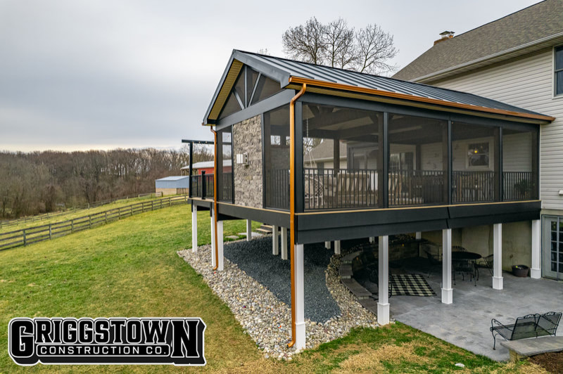 Photo of an expansive modern back mixed railing veranda in Other with a fireplace, decking and a roof extension.