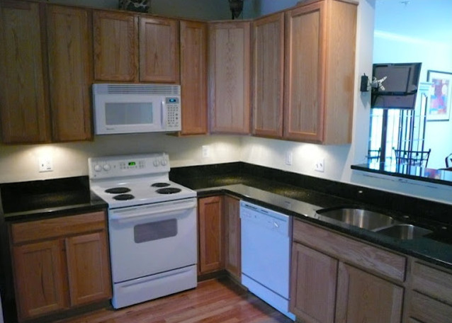 Transitional kitchen photo in DC Metro with beaded inset cabinets, light wood cabinets and an island