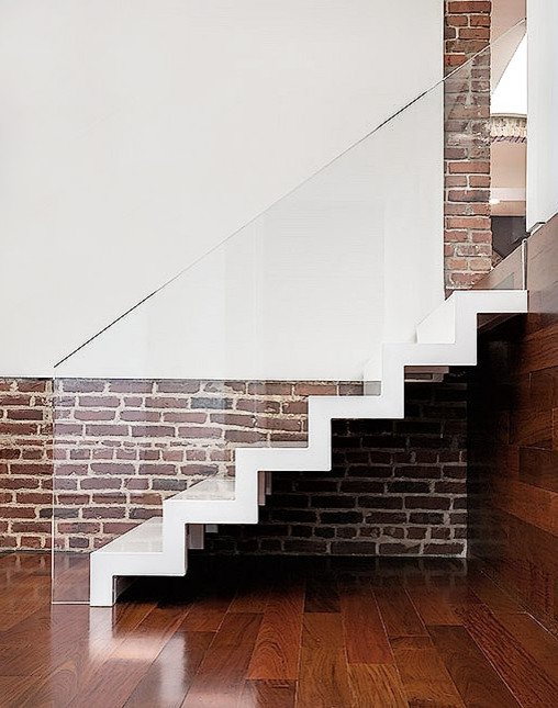 Photo of a mid-sized acrylic straight staircase in Kansas City.