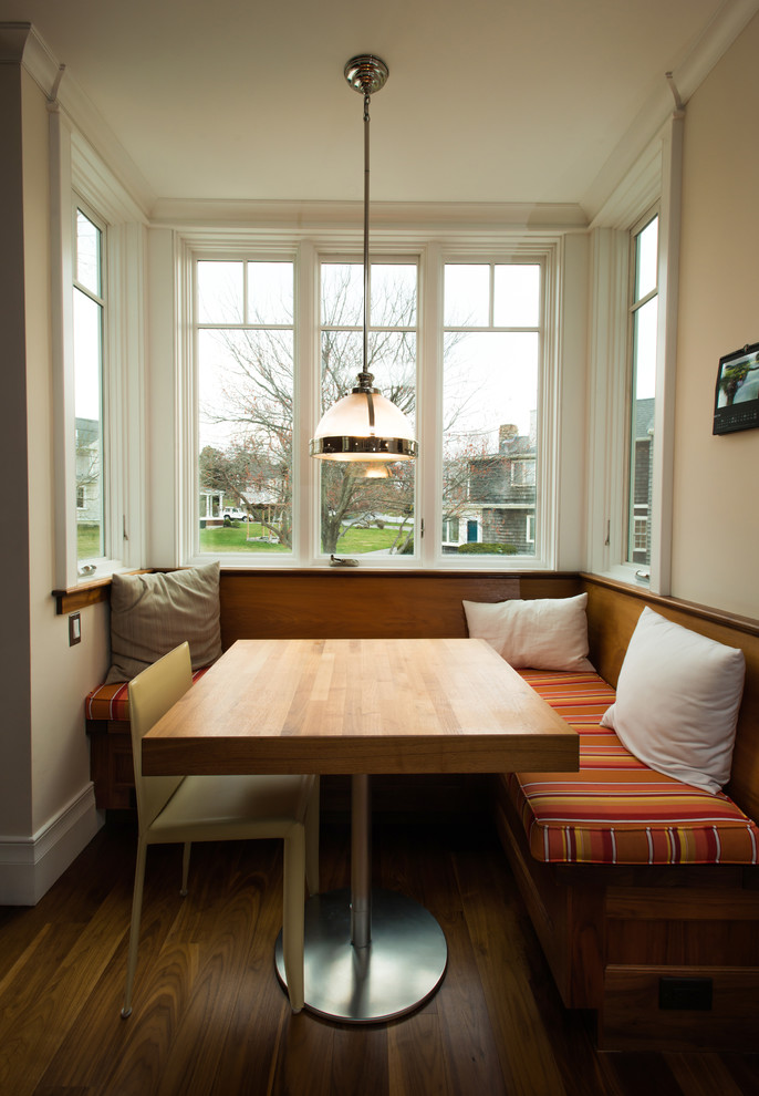 This is an example of a traditional dining room in Boston with beige walls.