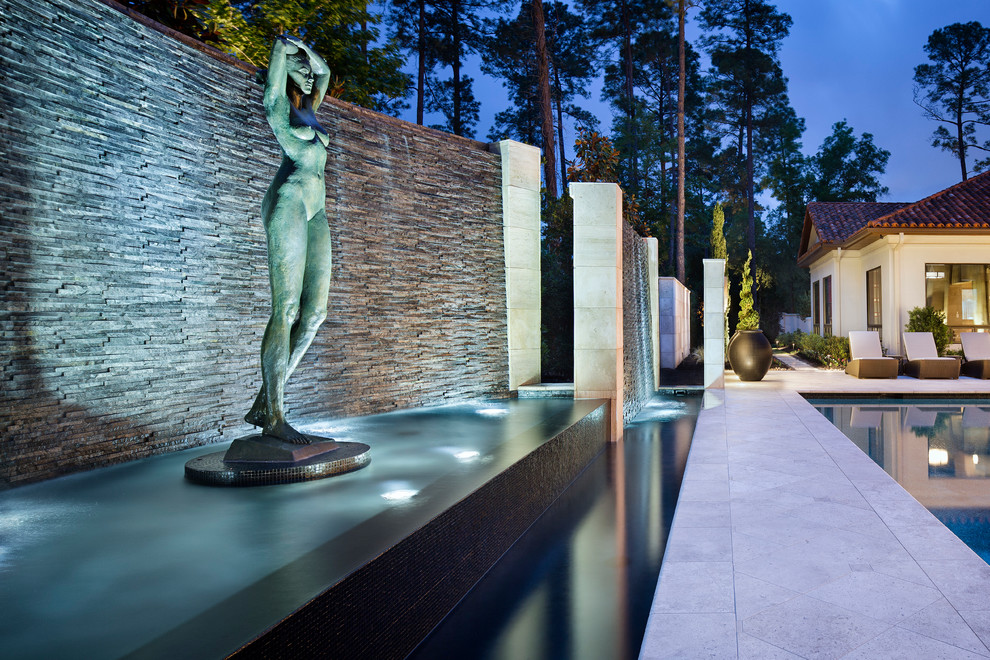 Example of a huge transitional backyard custom-shaped pool fountain design in Houston