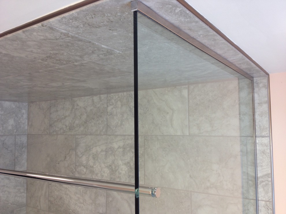 Mid-sized transitional kids' gray tile and porcelain tile porcelain tile alcove bathtub photo with an undermount sink, raised-panel cabinets, white cabinets, granite countertops and orange walls