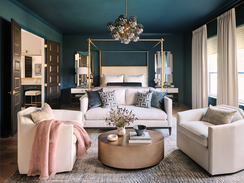 Example of a large transitional master light wood floor and beige floor bedroom design in Austin with blue walls