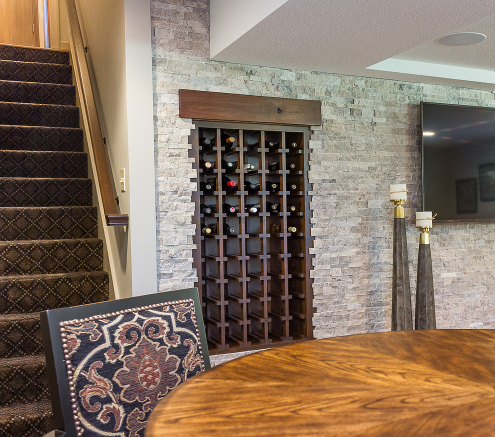 Design ideas for a mid-sized transitional wine cellar in Kansas City with carpet and beige floor.