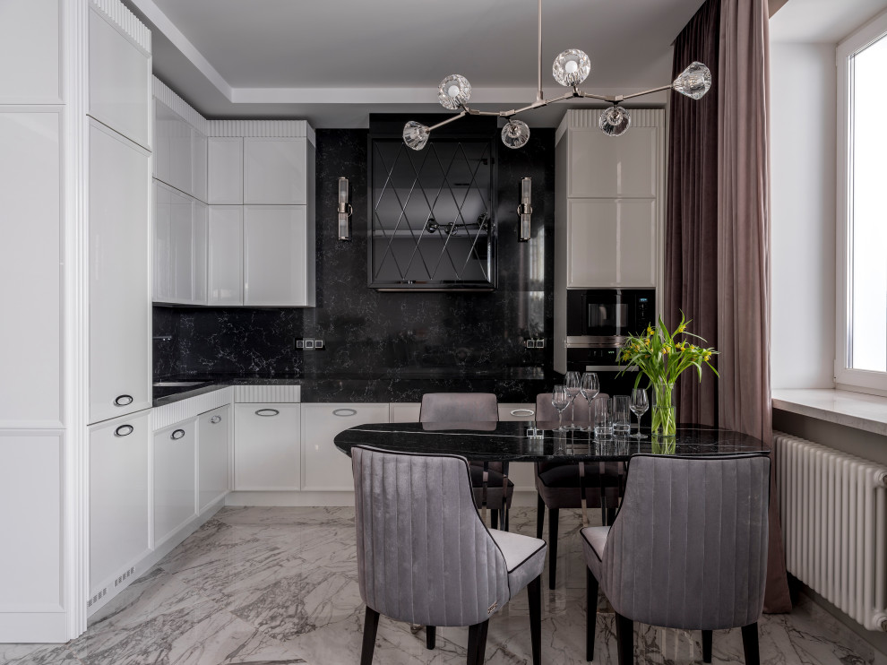 Mid-sized contemporary l-shaped open plan kitchen in Moscow with an undermount sink, white cabinets, black splashback, stone slab splashback, black appliances, porcelain floors, no island, white floor, black benchtop, recessed-panel cabinets and quartzite benchtops.
