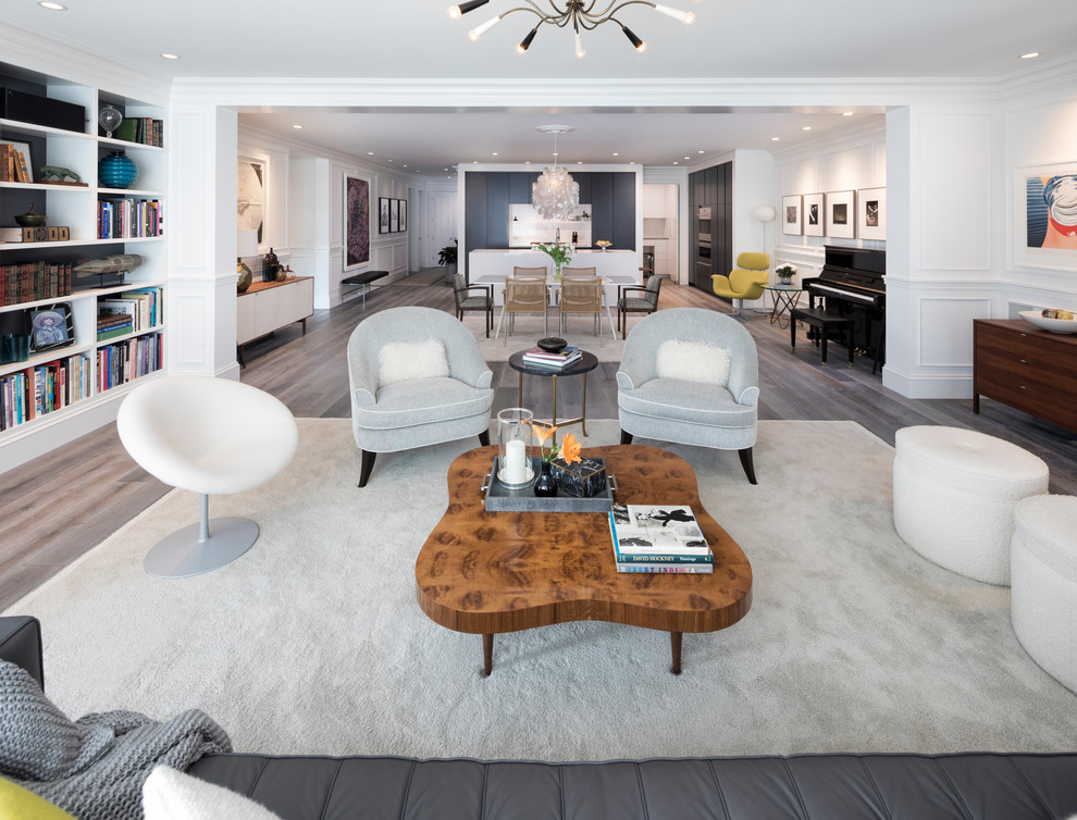 Inspiration for a mid-sized contemporary formal open concept living room in Minneapolis with white walls, medium hardwood floors, a standard fireplace, a stone fireplace surround, a built-in media wall and grey floor.