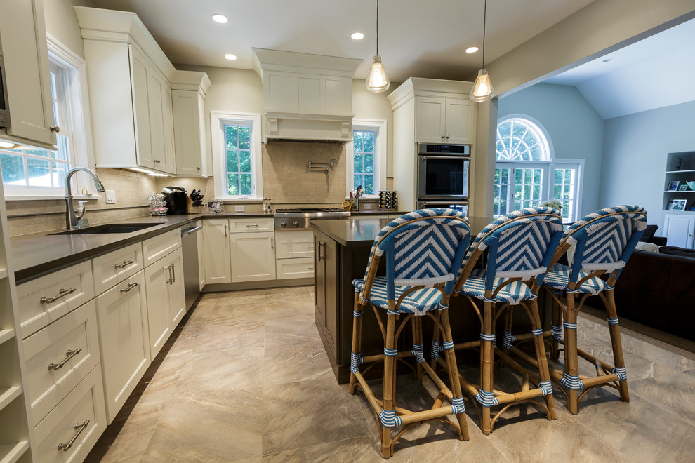 Open concept kitchen - mid-sized rustic l-shaped porcelain tile and beige floor open concept kitchen idea in Bridgeport with an undermount sink, shaker cabinets, white cabinets, granite countertops, beige backsplash, porcelain backsplash, stainless steel appliances and an island