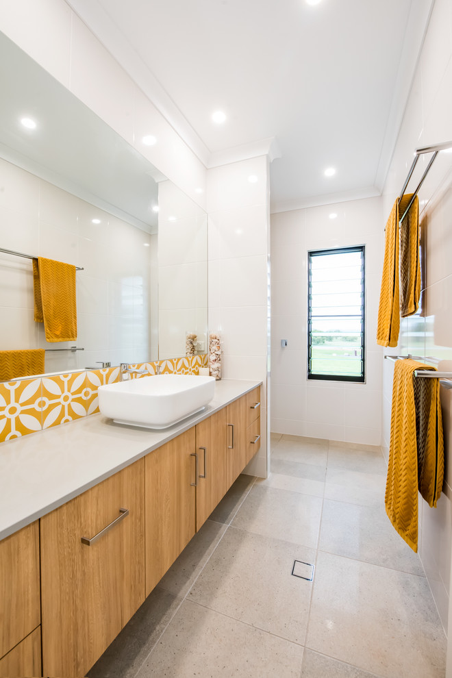 Photo of a mid-sized contemporary kids bathroom in Other with flat-panel cabinets, light wood cabinets, an open shower, white tile, ceramic tile, white walls, ceramic floors, a vessel sink, granite benchtops, grey floor, an open shower, grey benchtops, a niche, a single vanity and a floating vanity.
