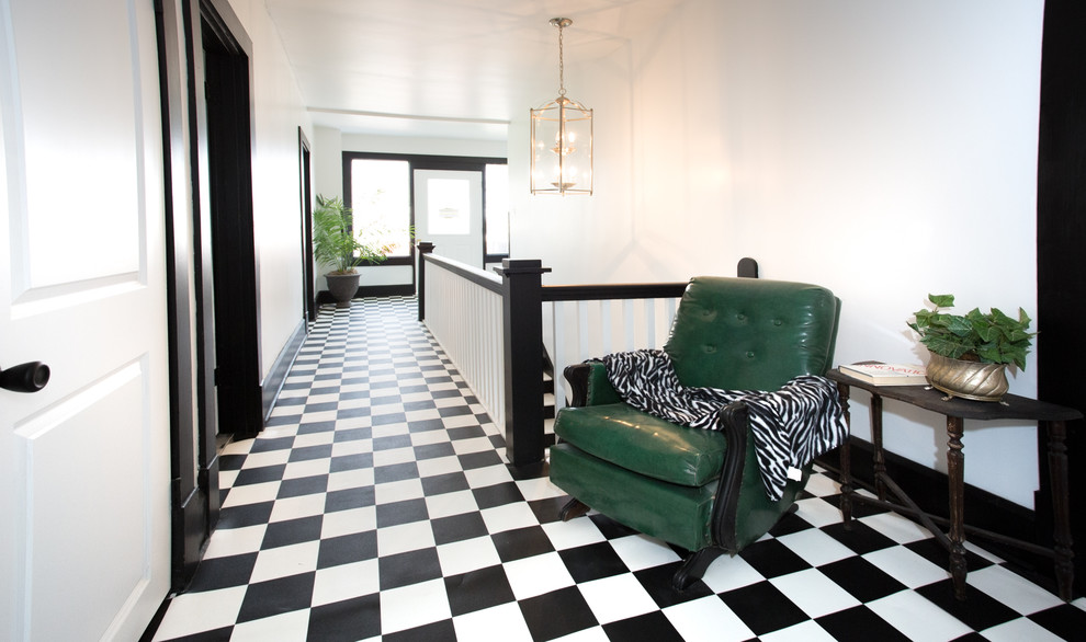 Hallway - large transitional vinyl floor and black floor hallway idea with white walls
