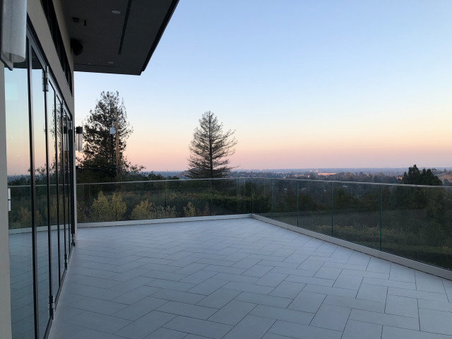Nana Door & Glass Rail Remodel contemporary-balcony