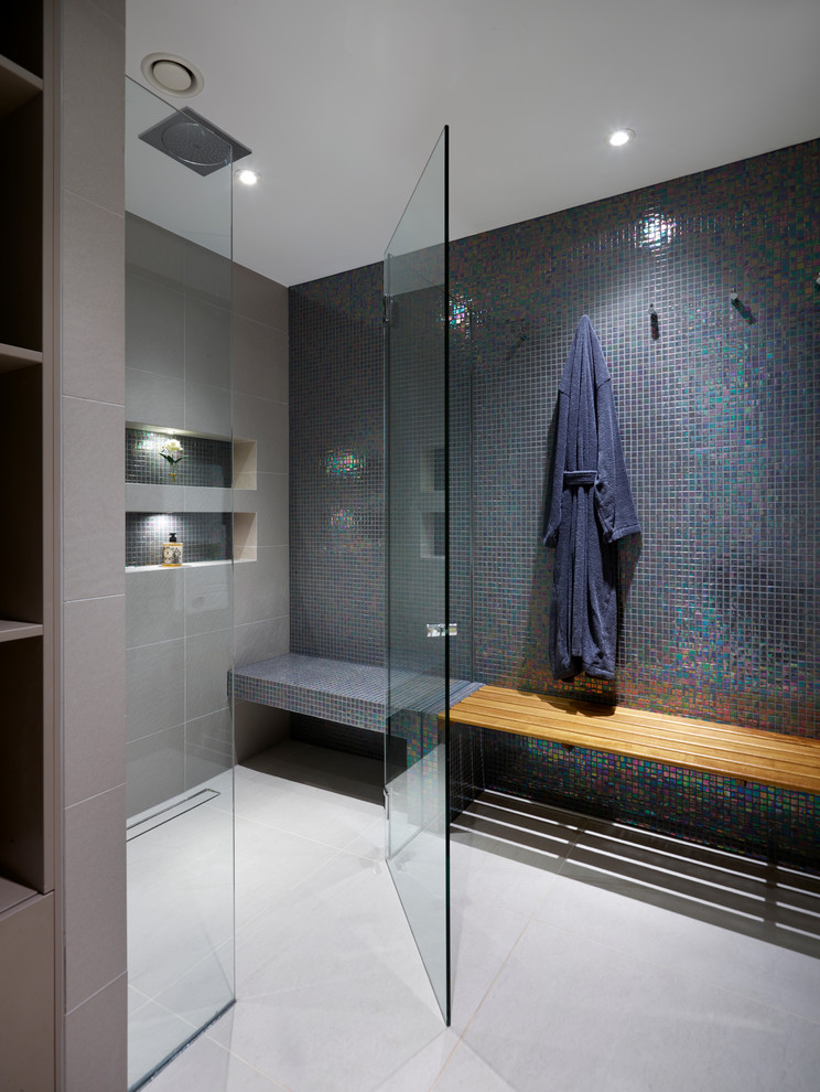 Photo of a contemporary bathroom in Los Angeles with a curbless shower and mosaic tile.