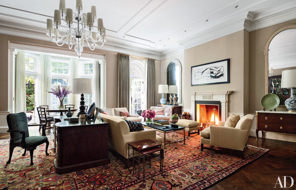 This is an example of a large traditional formal open concept living room in New York with beige walls, dark hardwood floors, a standard fireplace, a wood fireplace surround, no tv and brown floor.