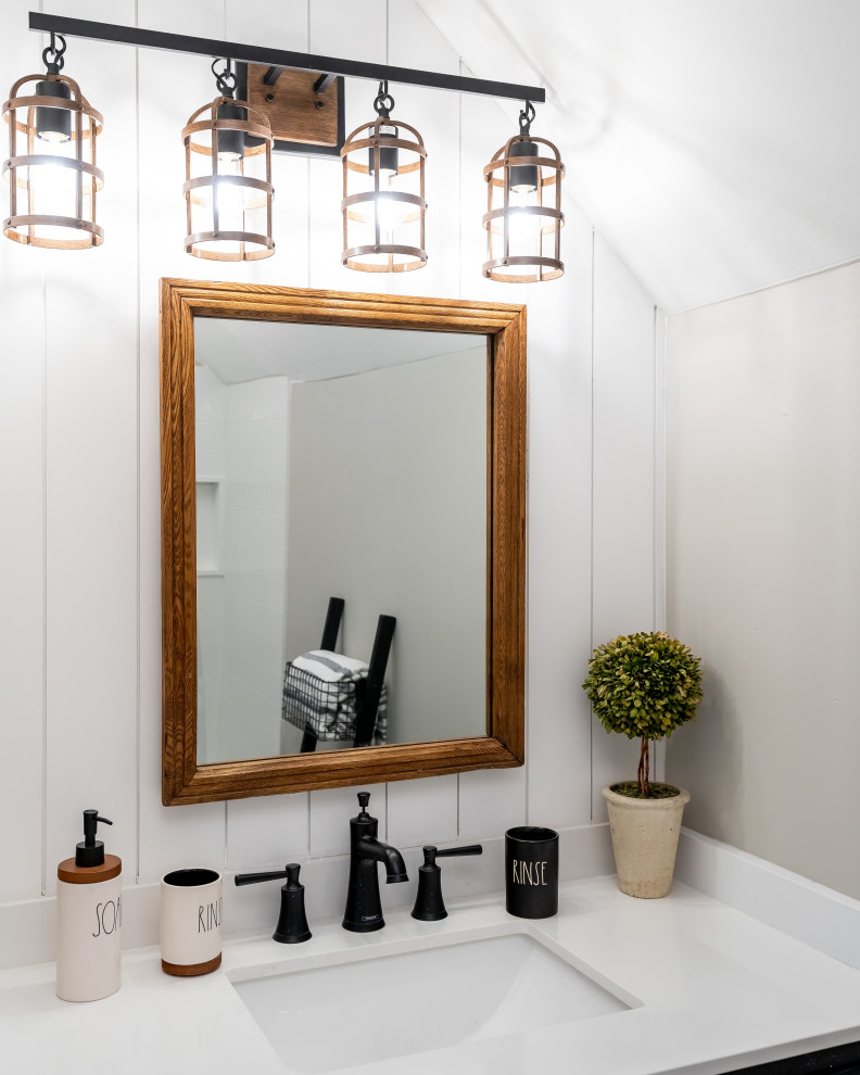 Inspiration for a mid-sized country master bathroom in Boston with black cabinets, an alcove tub, a shower/bathtub combo, a two-piece toilet, vinyl floors, a drop-in sink, engineered quartz benchtops, grey floor, a hinged shower door, white benchtops, a single vanity, a freestanding vanity and vaulted.