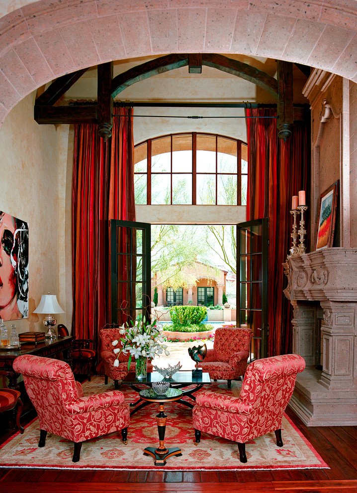 This is an example of a traditional formal living room in Phoenix with red floor.