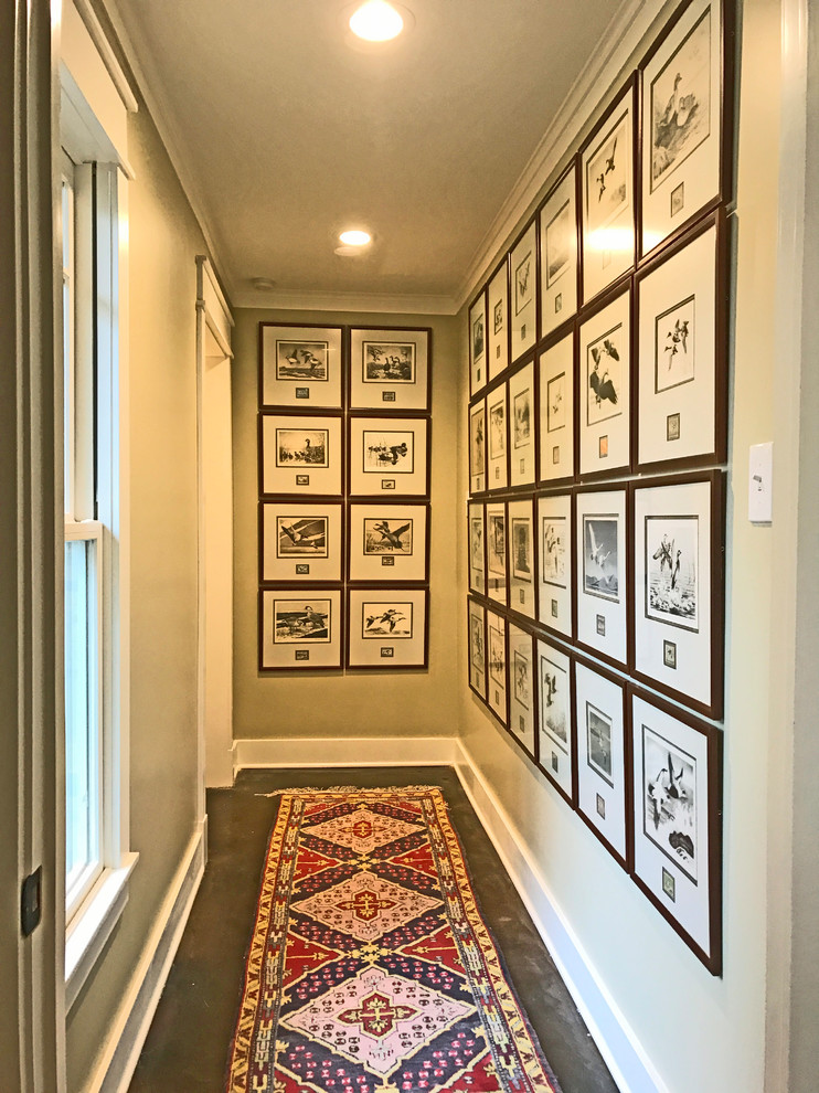 Arts and crafts hallway in New Orleans with beige walls and concrete floors.