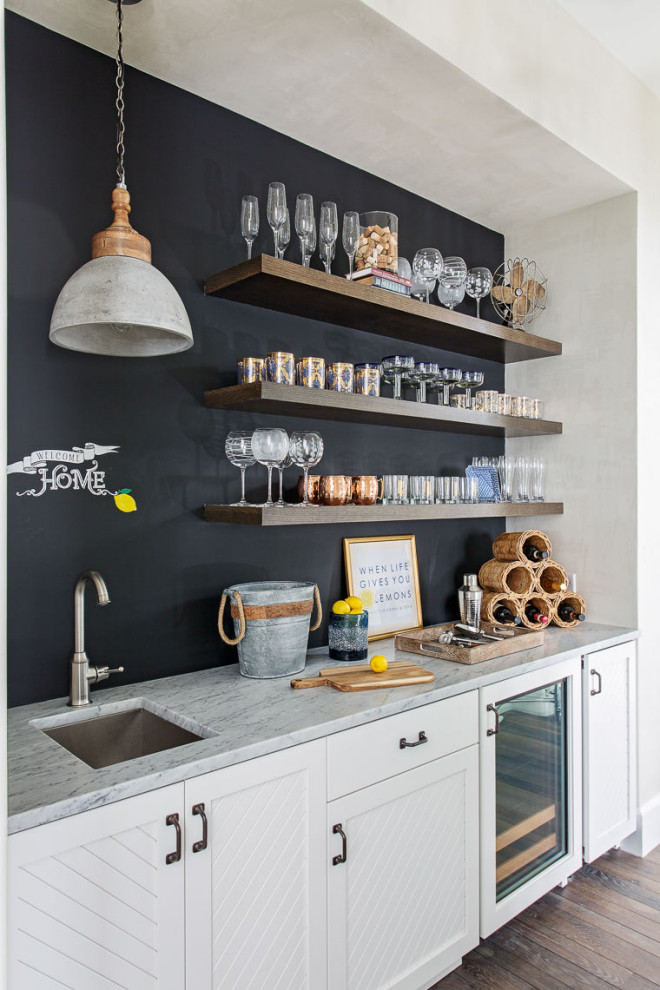 Inspiration for a beach style home bar in Charleston with a feature wall.
