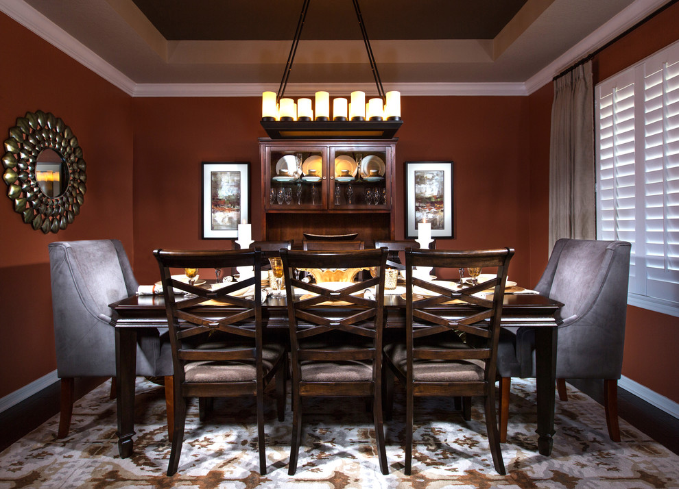 Large beach style separate dining room in Orlando with dark hardwood floors and brown walls.