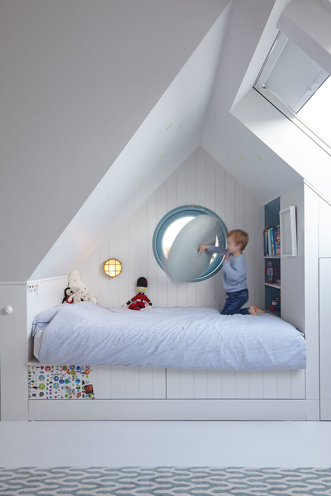 Transitional kids' bedroom in London with white walls and white floor for kids 4-10 years old and boys.