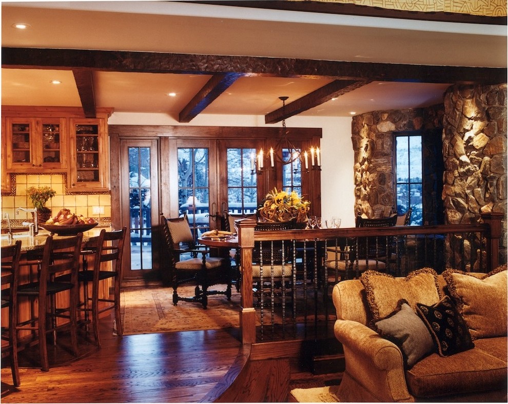 Large mountain style dark wood floor kitchen/dining room combo photo in Denver with white walls