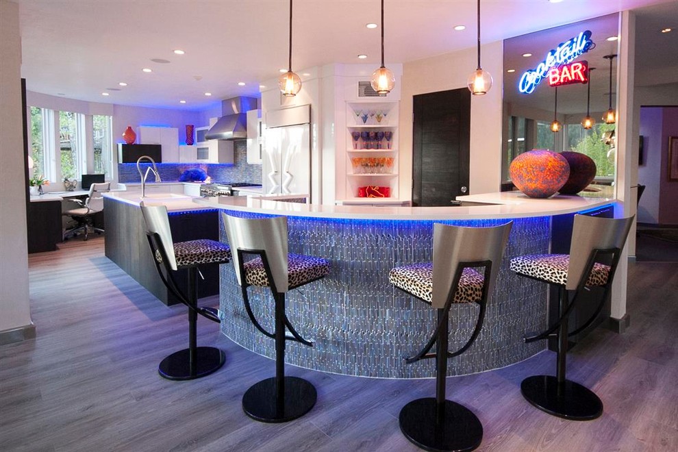 Photo of a mid-sized contemporary galley seated home bar in Denver with an integrated sink, flat-panel cabinets, dark wood cabinets, quartz benchtops, blue splashback, glass tile splashback and dark hardwood floors.