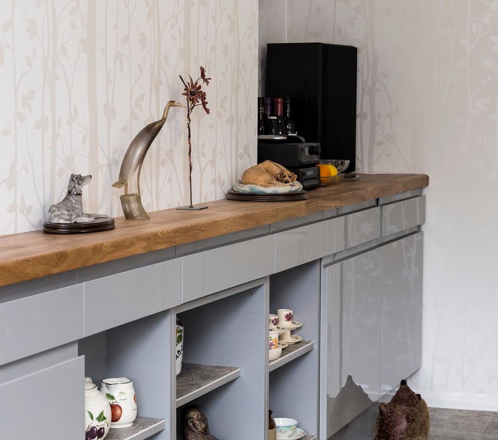 Design ideas for a medium sized contemporary open plan kitchen in Kent with flat-panel cabinets, grey cabinets, quartz worktops, coloured appliances and an island.