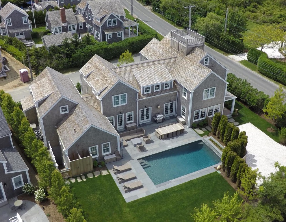 Example of a transitional home design design in Boston