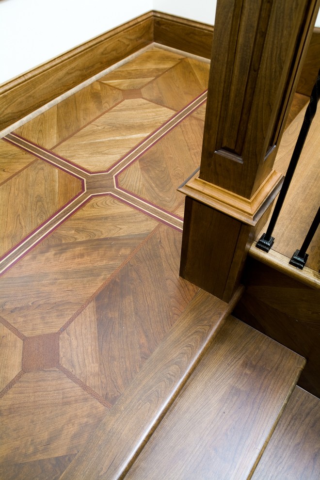 Design ideas for a large traditional wood l-shaped staircase in Chicago with wood risers.