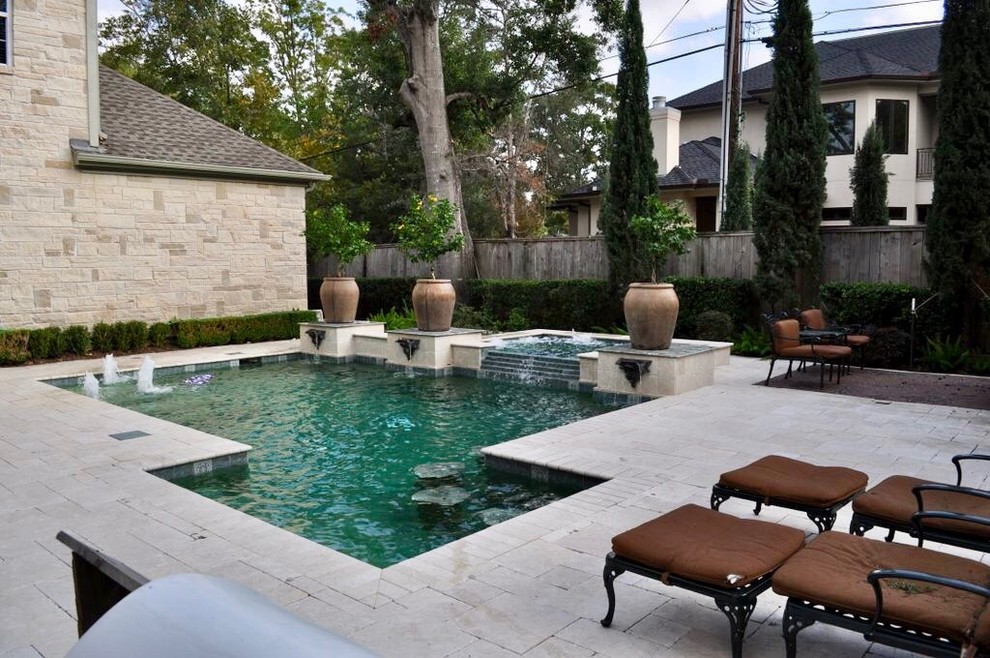 Inspiration for a mid-sized mediterranean backyard concrete paver and custom-shaped pool fountain remodel in Houston