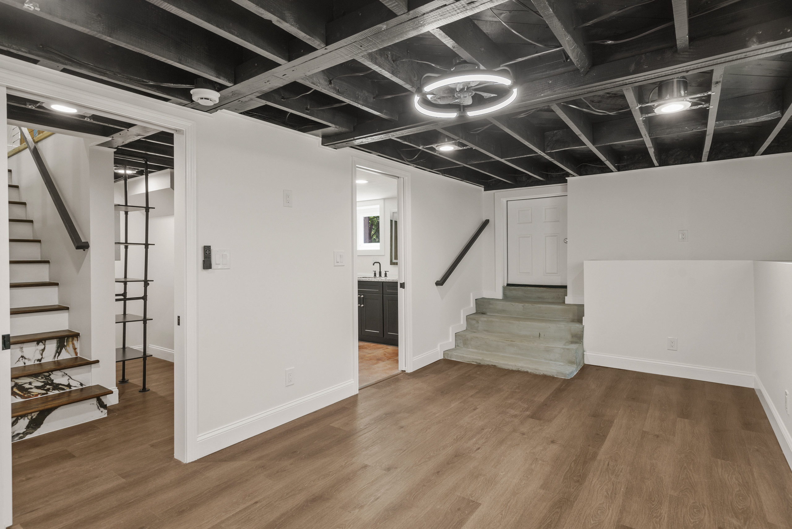 Mid-sized minimalist vinyl floor and brown floor basement photo in Atlanta