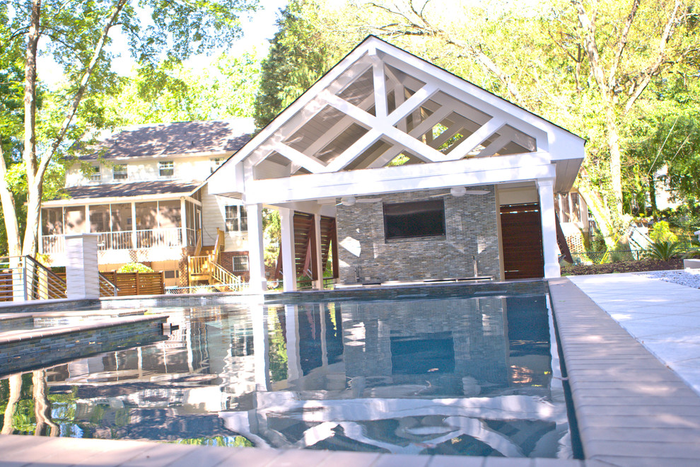 Large trendy backyard custom-shaped and tile natural pool house photo