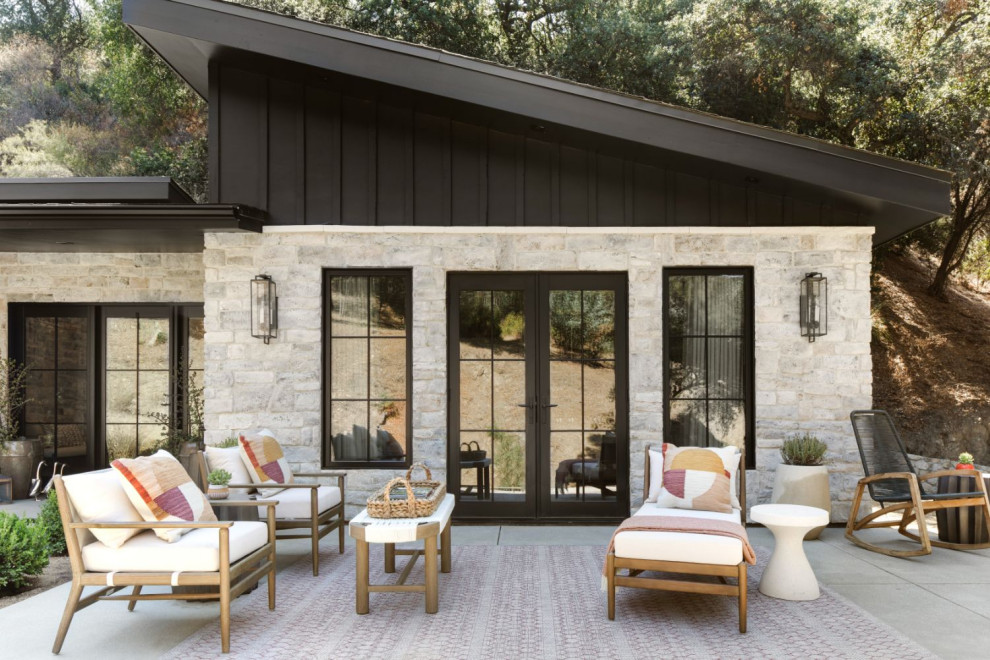 This is an example of a medium sized contemporary back patio in Los Angeles with a potted garden and no cover.