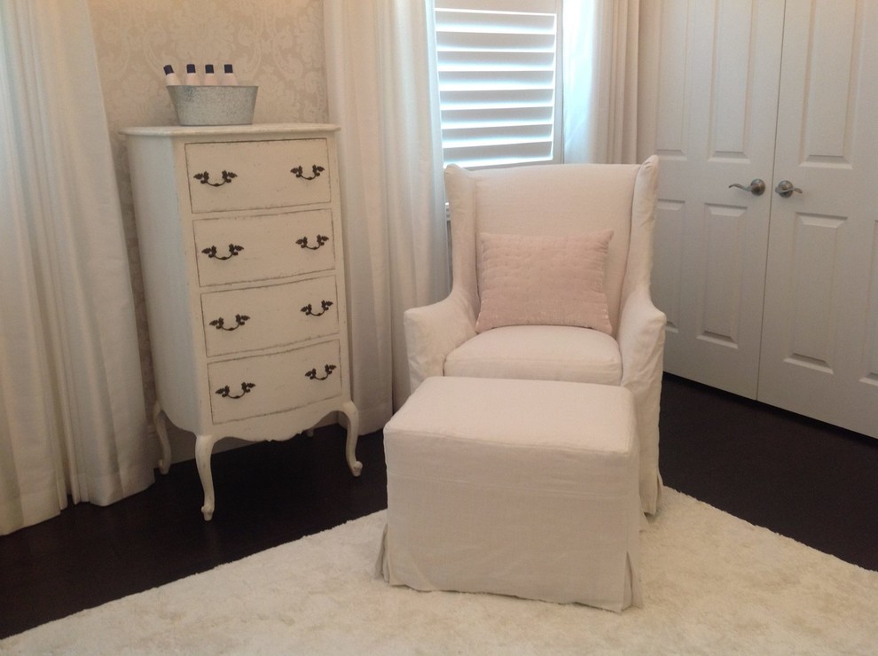 Mid-sized traditional nursery in Miami with beige walls and dark hardwood floors for girls.