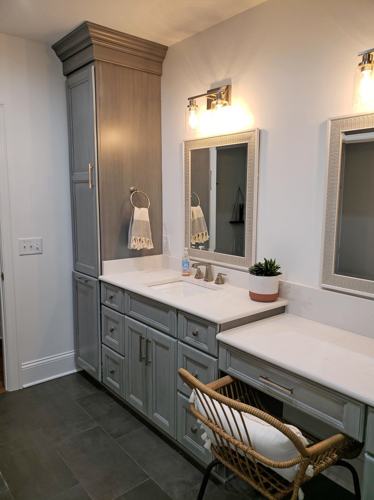 Photo of a medium sized classic family bathroom in Nashville with flat-panel cabinets, grey cabinets, an alcove shower, a two-piece toilet, white tiles, porcelain tiles, white walls, porcelain flooring, a submerged sink, engineered stone worktops, grey floors, a sliding door, white worktops, a shower bench, a single sink and a built in vanity unit.