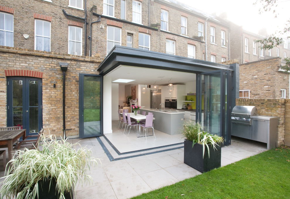 This is an example of a mid-sized contemporary patio in London.