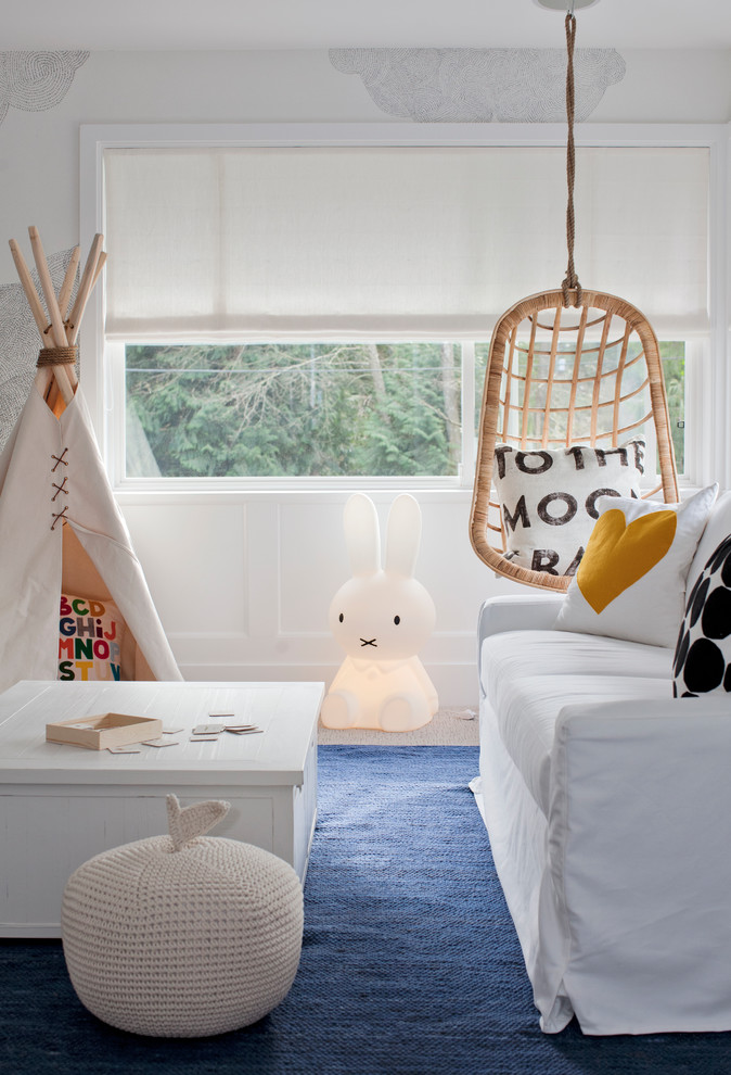 Contemporary gender-neutral kids' room in Vancouver with white walls and blue floor.