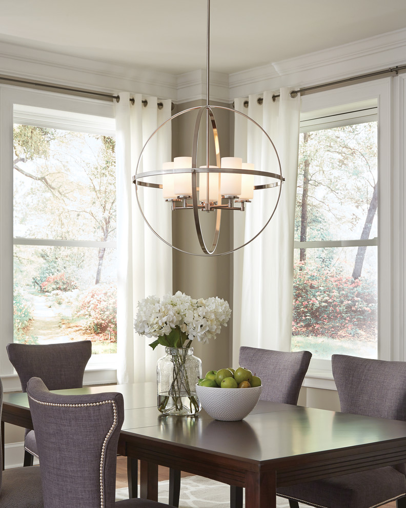 Inspiration for a mid-sized transitional medium tone wood floor dining room remodel with black walls