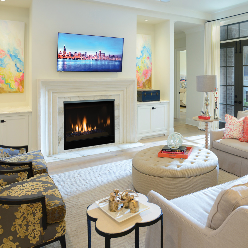 This is an example of a contemporary living room in Orange County with a ribbon fireplace.