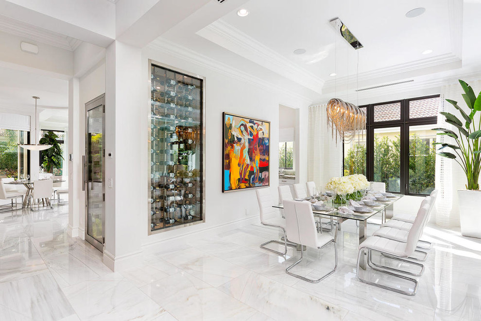 Example of a trendy dining room design in Miami with white walls